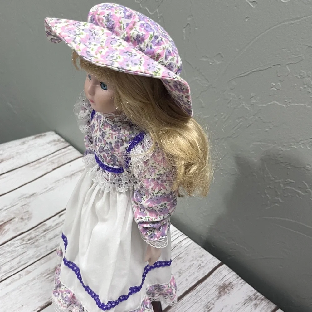Porcelain Doll with purple floral dress and‎ Hat vintage